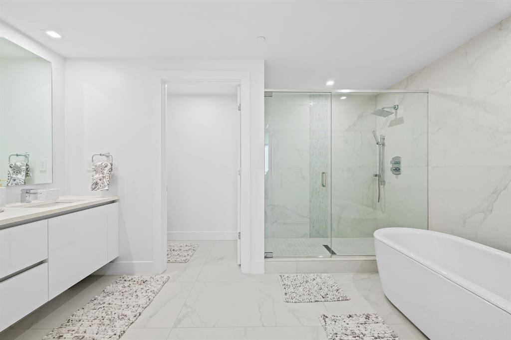 730 North Ocean Boulevard, Unit 1201 Pompano Beach, FL 33062 - Photo 38 of 40 a bathroom with a bathtub a sink a toilet and shower