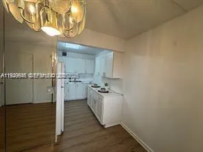 a kitchen with a sink and refrigerator