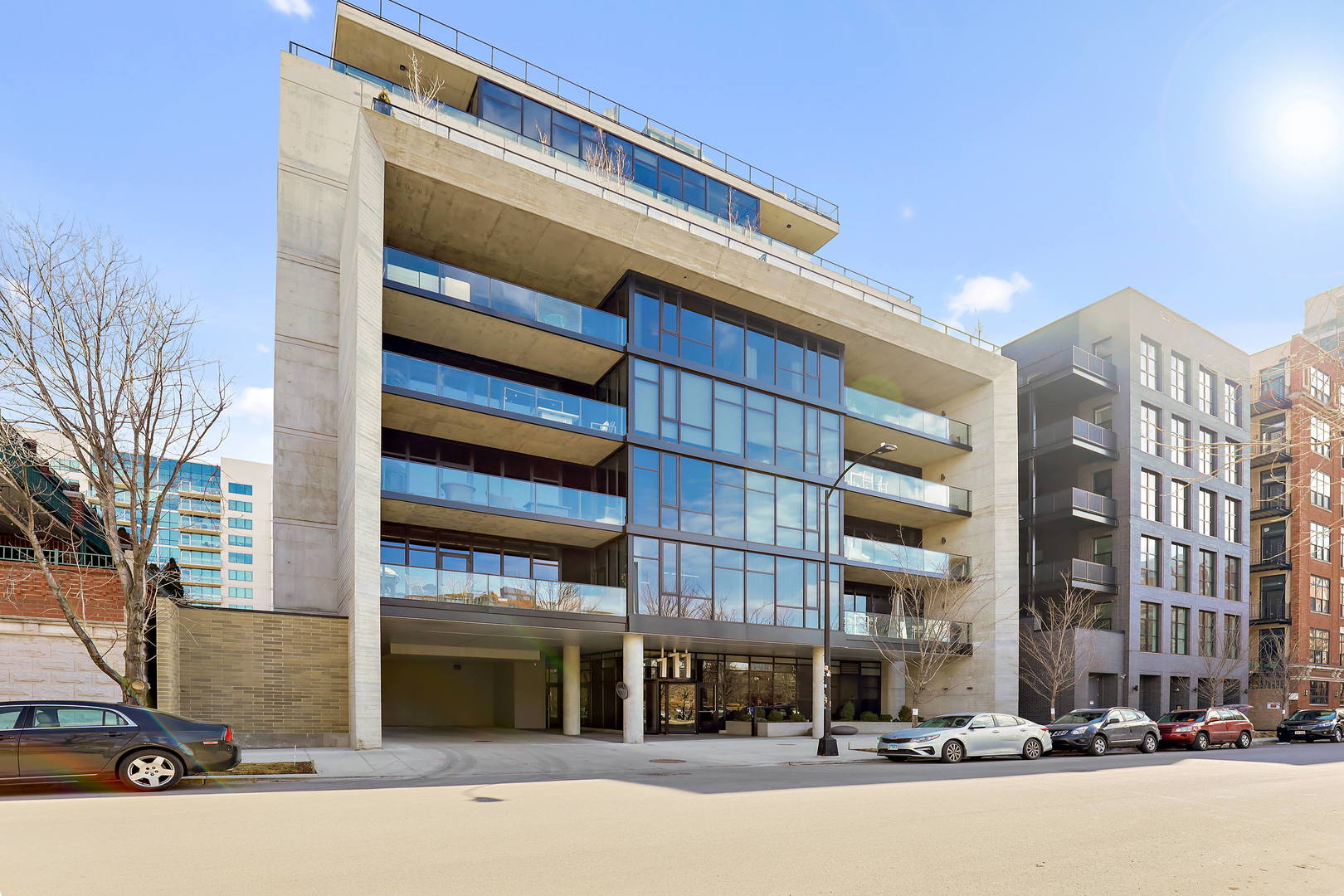 111 South Peoria Street, Unit 406 Chicago, IL 60607 - Photo 1 of 26 a front view of a building with street