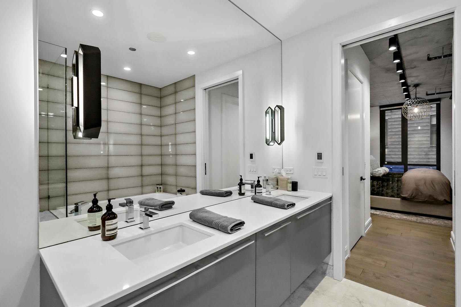 111 South Peoria Street, Unit 406 Chicago, IL 60607 - Photo 20 of 26 a bathroom with a sink double vanity