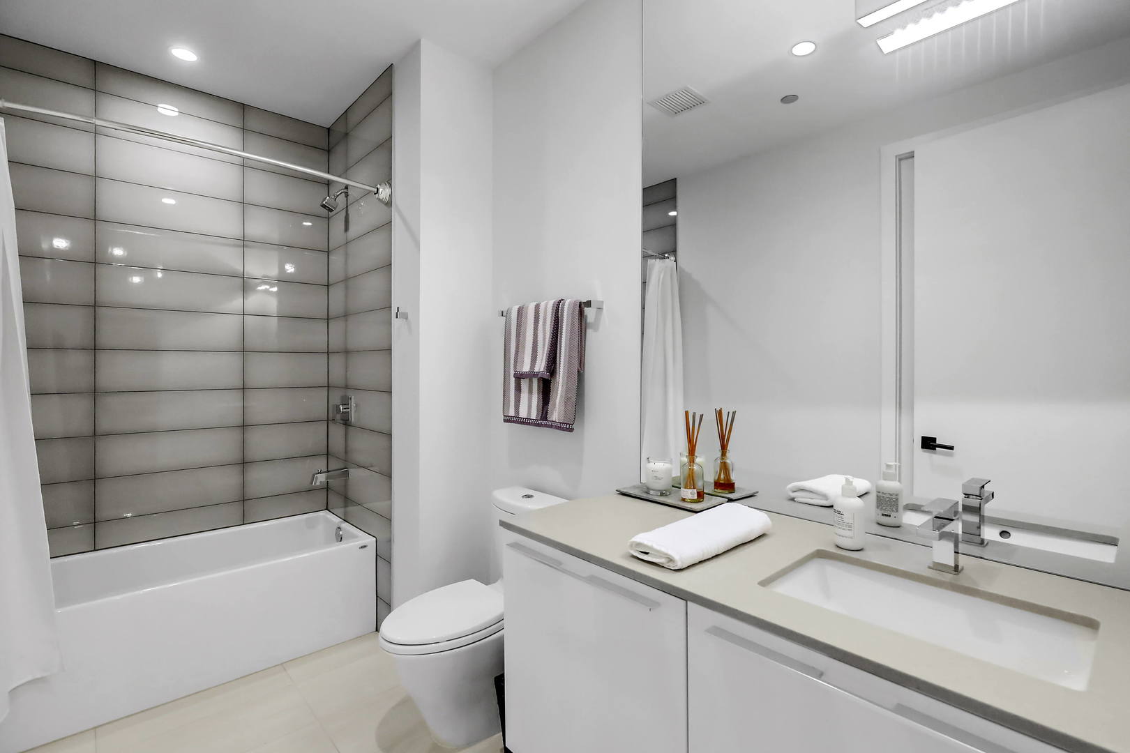 111 South Peoria Street, Unit 406 Chicago, IL 60607 - Photo 25 of 26 a bathroom with a sink toilet and shower