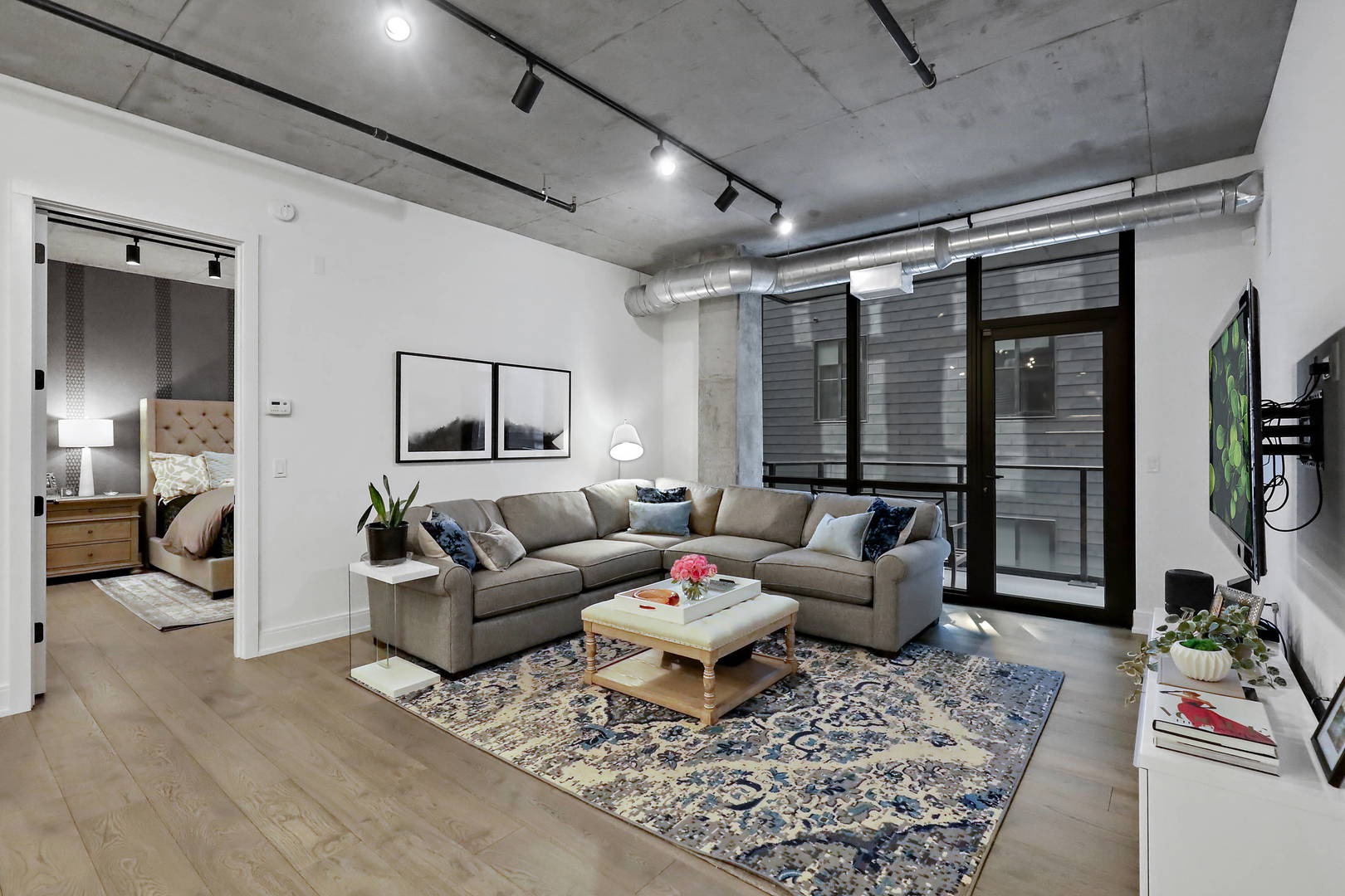 111 South Peoria Street, Unit 406 Chicago, IL 60607 - Photo 10 of 26 a living room with furniture and a rug