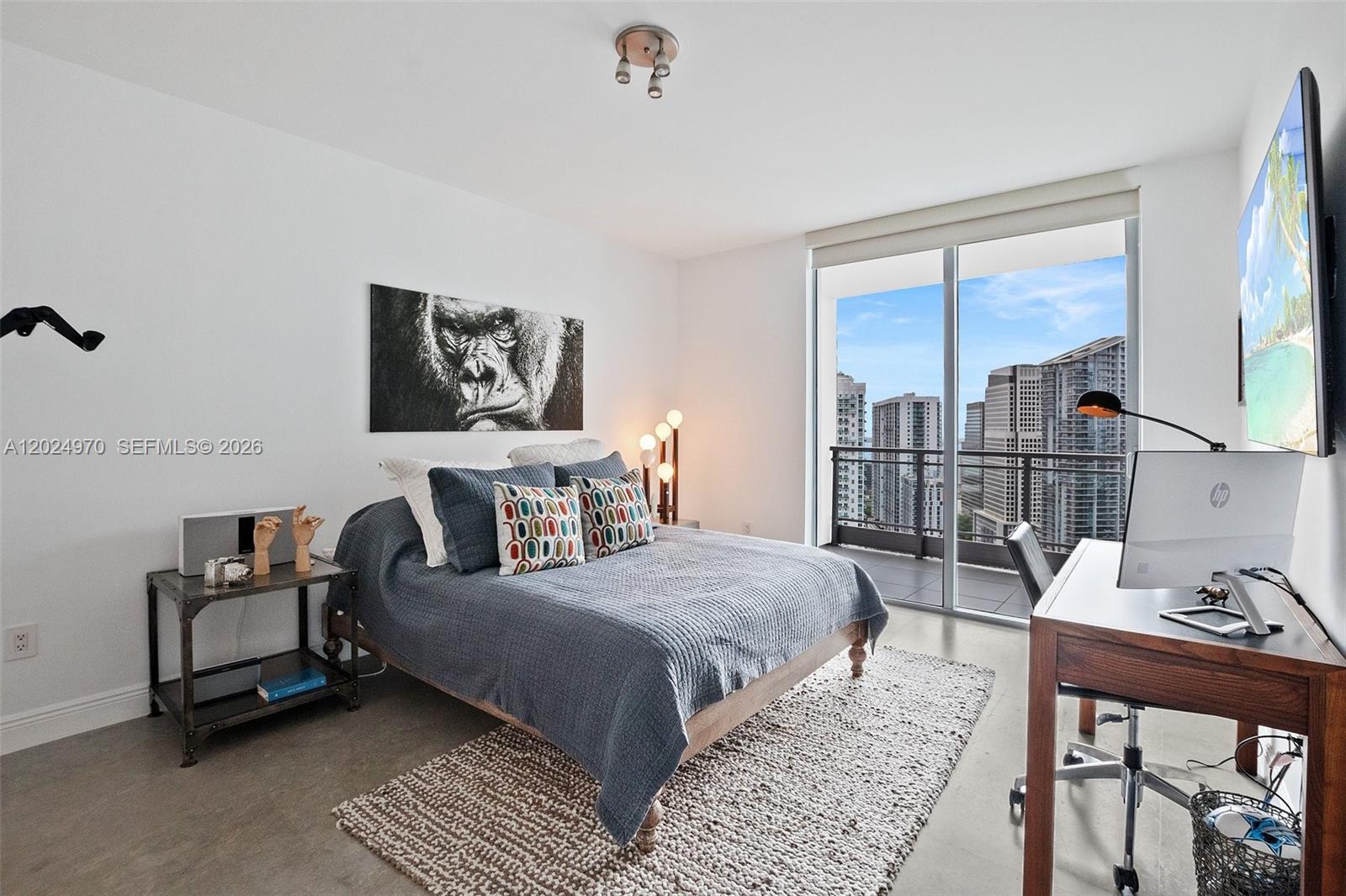 90 Southwest 3rd Street, Unit 3810 Miami, FL 33130 - Photo 27 of 45 a bedroom with a bed a couch and a window