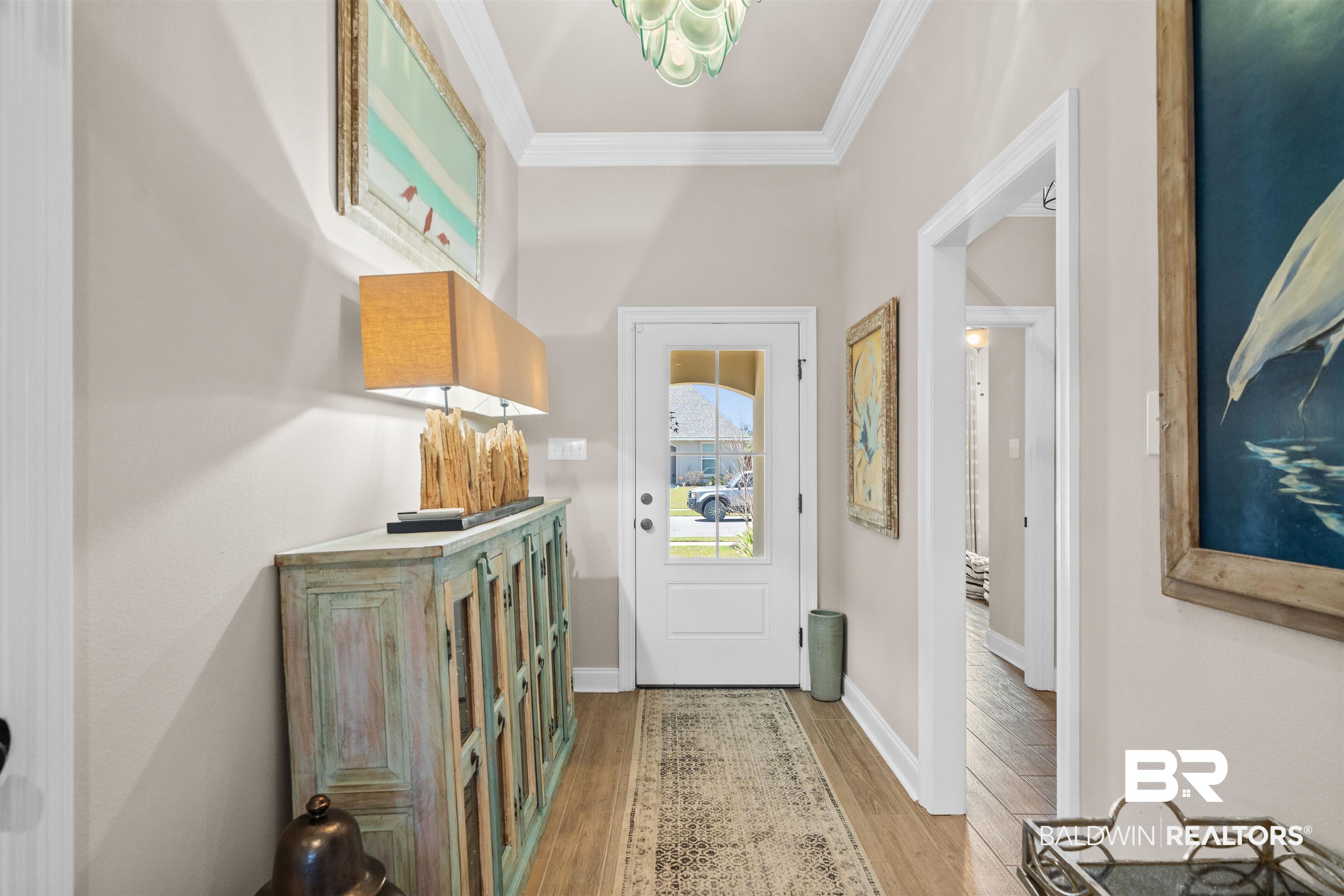 1509 Fenton Circle Foley, AL 36535 - Photo 6 of 34 Doorway featuring baseboards, crown molding, and light wood-style floors