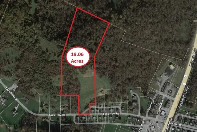 a street sign on a pole on a wall