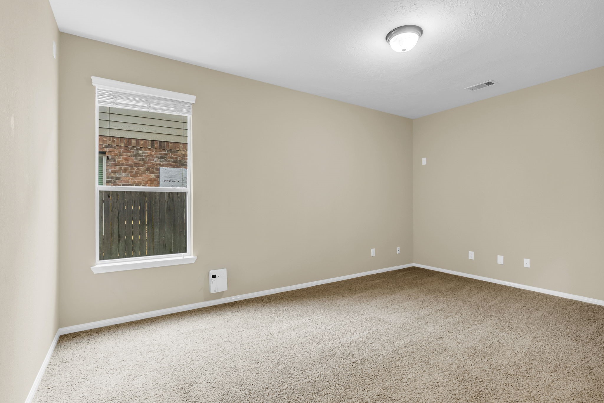 16619 Dover Mills Drive Spring, TX 77379 - Photo 19 of 49 an empty room with a window