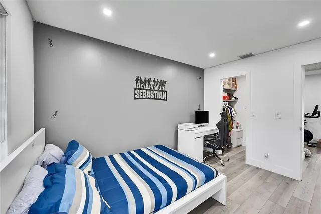 a bedroom with a bed and furniture