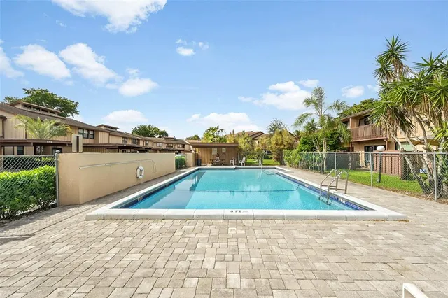 a view of a swimming pool with a lounge chairs