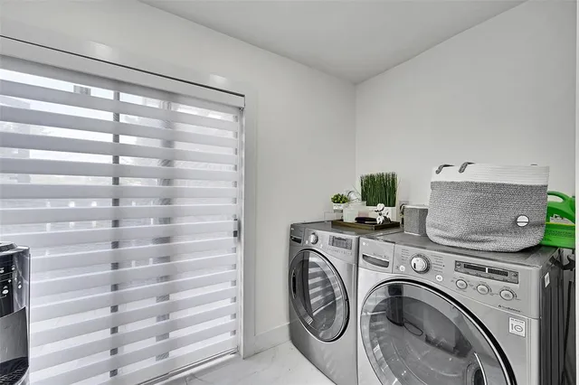 a view of washer and dryer in a utility room