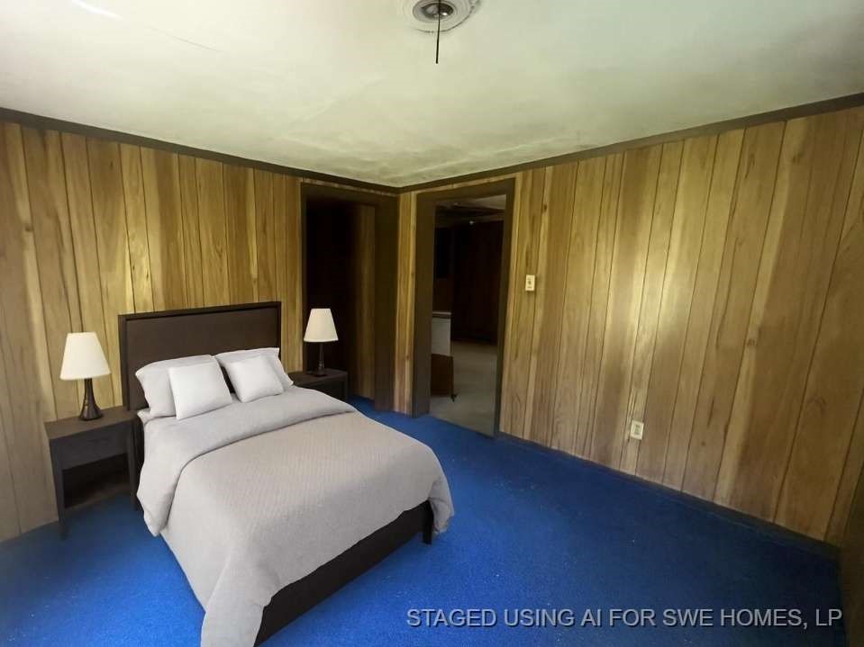 616 Post Oak Road Grapeland, TX 75844 - Photo 9 of 10 a spacious bedroom with a bed and a window