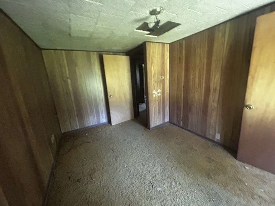 616 Post Oak Road Grapeland, TX 75844 - Photo 10 of 10 a view of a chandelier fan and windows in a room