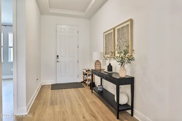 a view of a room that has a table and chairs in it