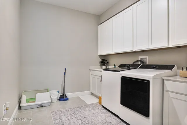 a bed sitting in a room next to a window