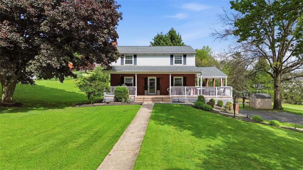 129 Meadowbrook Road Renfrew, PA 16053 - Photo 1 of 45 a front view of a house with yard patio and green space