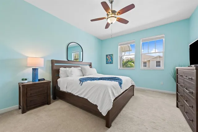 a bedroom with a bed dresser and a window