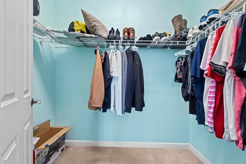 a bathroom with a shower sink and mirror