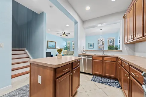 a kitchen with stainless steel appliances granite countertop a sink stove and microwave
