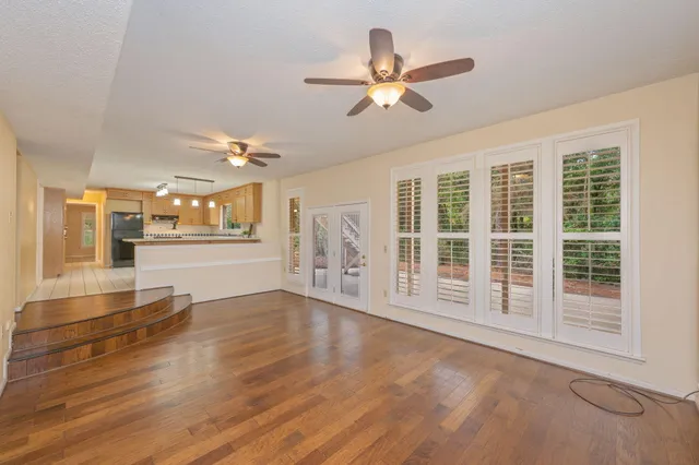 a kitchen with stainless steel appliances a sink and a refrigerator