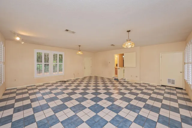 a view of a room with a black white checkered floor