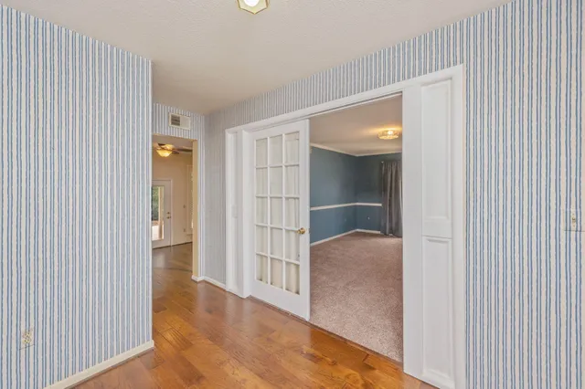 a view of an empty room with a window