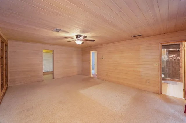 a view of a balcony with wooden floor