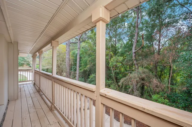 a view of a balcony with trees