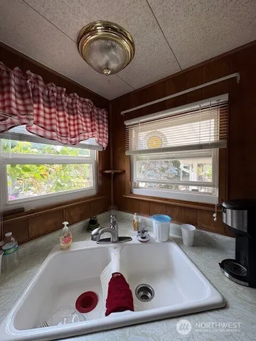 a bedroom with bed and a night stand