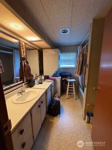 a room with furniture pool table and a projector