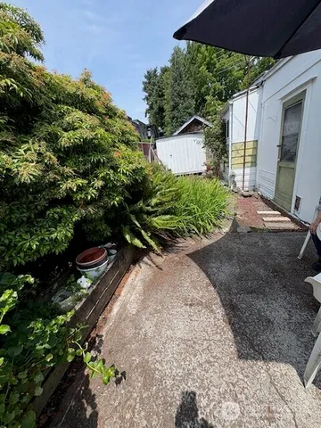 a view of a lake with a house in the background