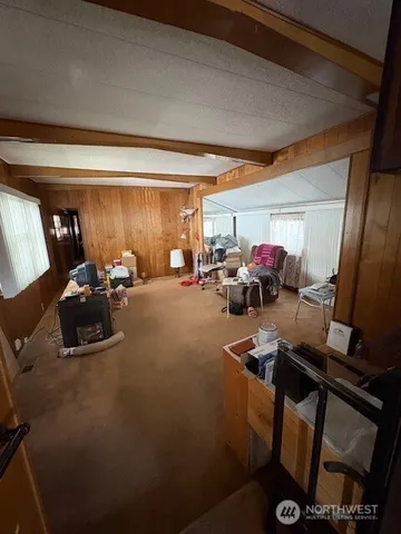 a gym room with furniture and a window