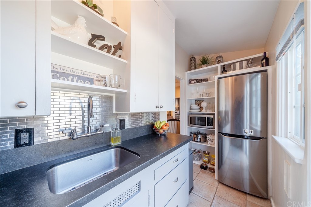 1853 Allen Avenue Pasadena, CA 91104 - Photo 19 of 38 a kitchen with stainless steel appliances granite countertop a refrigerator and a sink