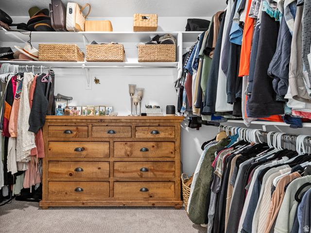 627 South Meade Street Mapleton, UT 84664 - Photo 22 of 37 Built-in closet system featuring multiple hanging rods, overhead shelving, and a large wood-finish dresser with drawer storage