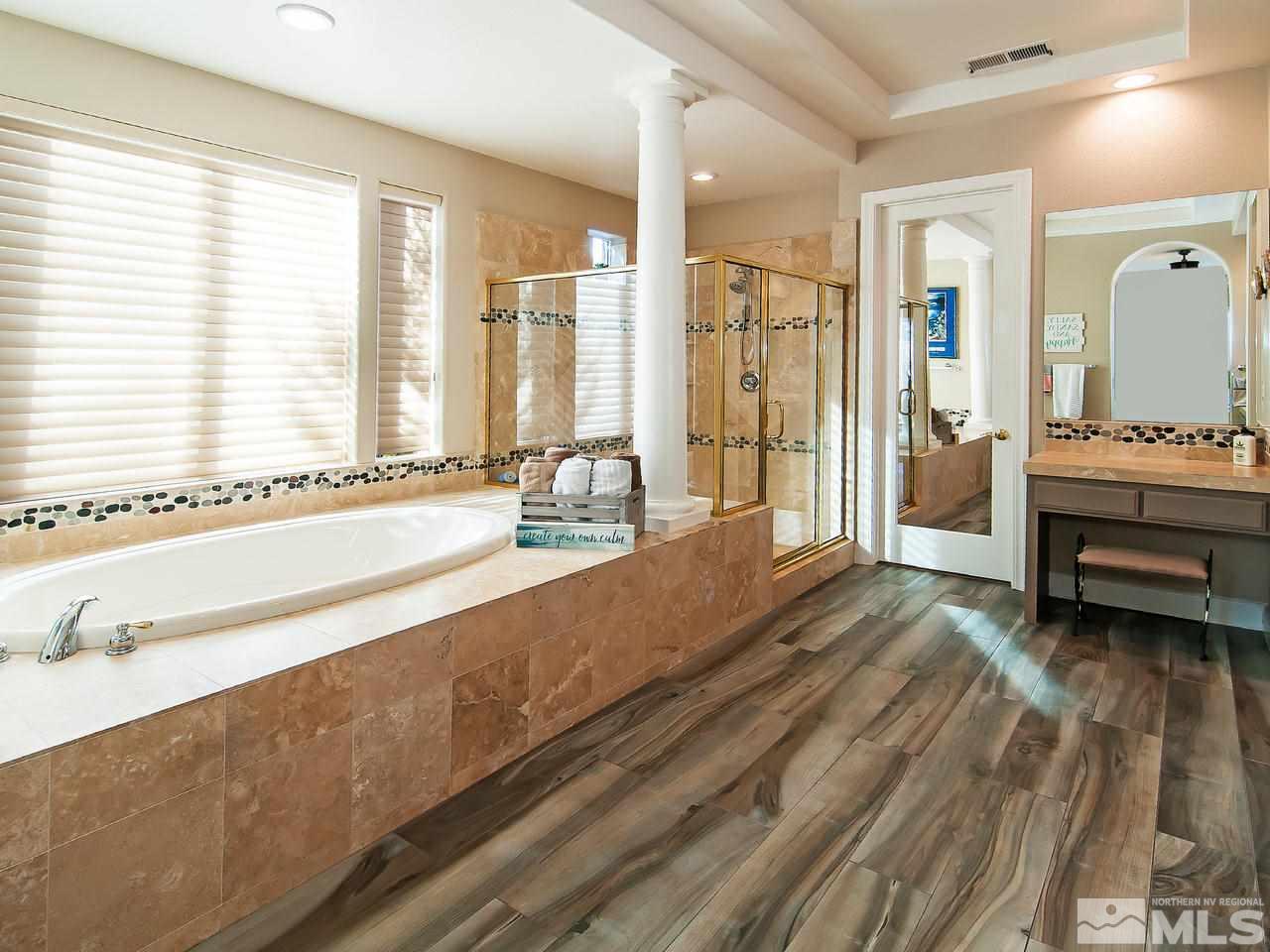 2690 Strathmore Court Reno, NV 89521 - Photo 13 of 25 a spacious bathroom with a tub and a large window