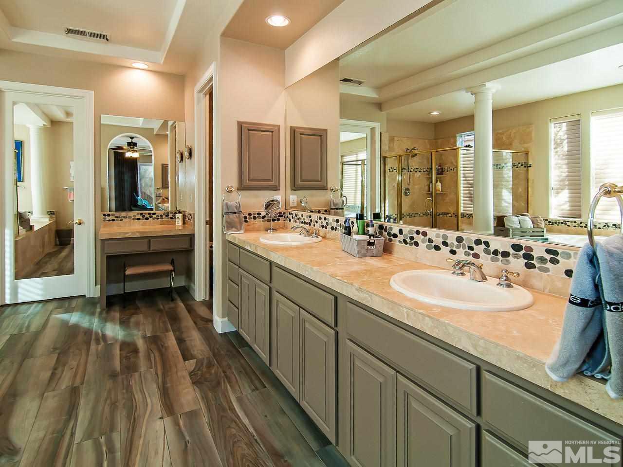 2690 Strathmore Court Reno, NV 89521 - Photo 14 of 25 a bathroom with a sink and a mirror