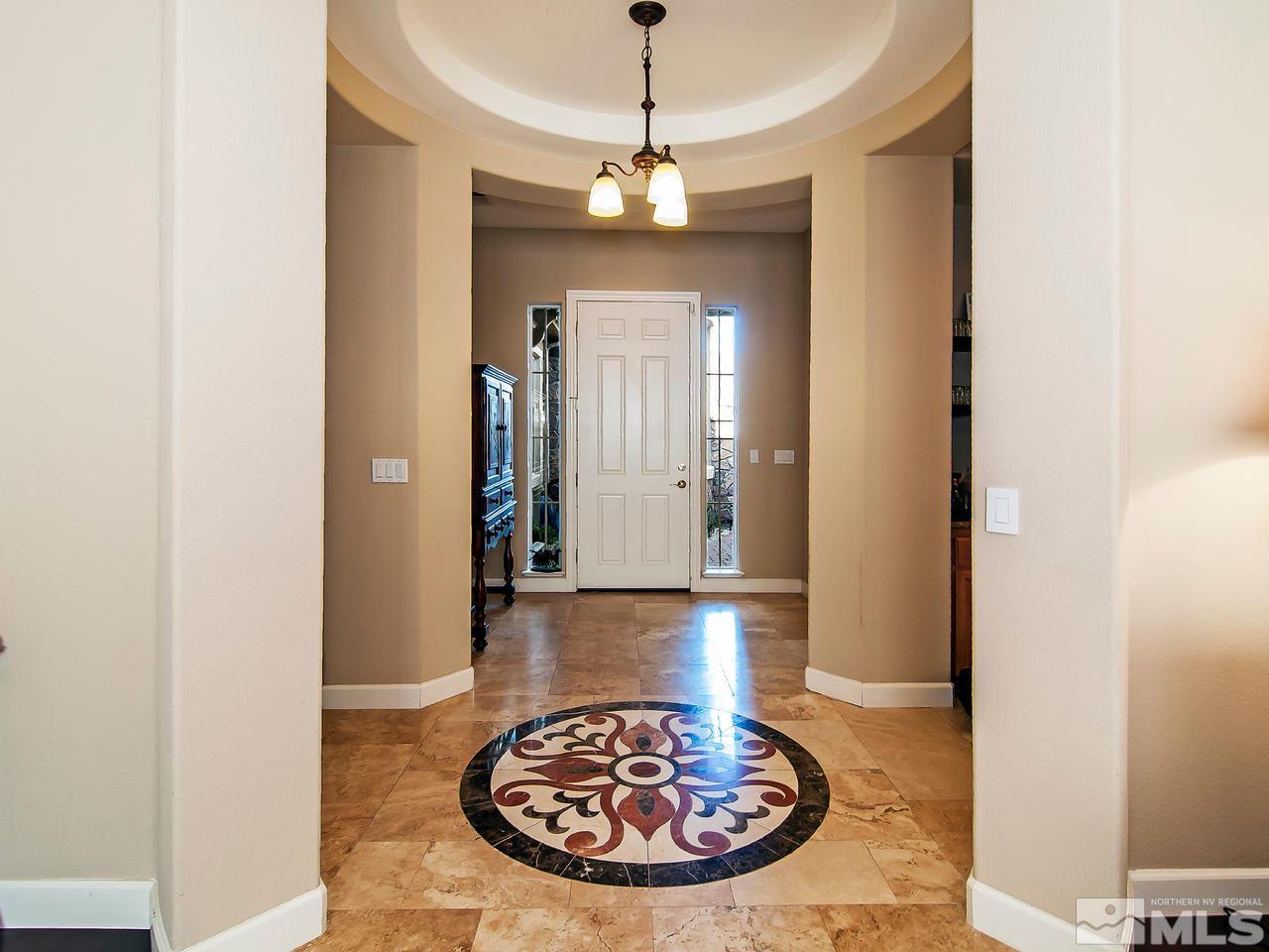 2690 Strathmore Court Reno, NV 89521 - Photo 2 of 25 a view of a hallway with a table and chairs