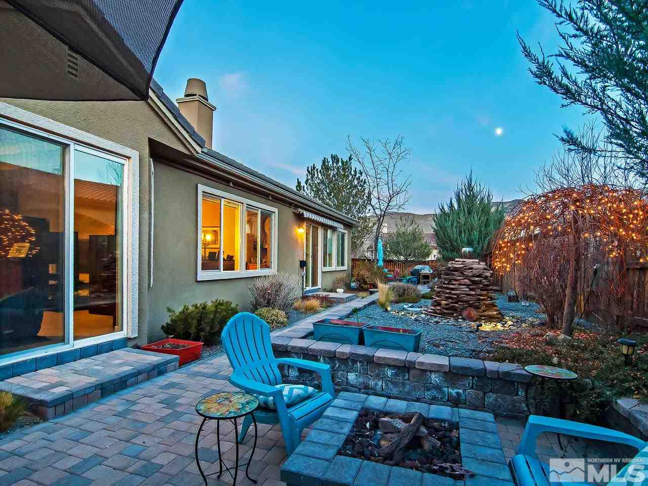 2690 Strathmore Court Reno, NV 89521 - Photo 23 of 25 a front view of a house with outdoor seating