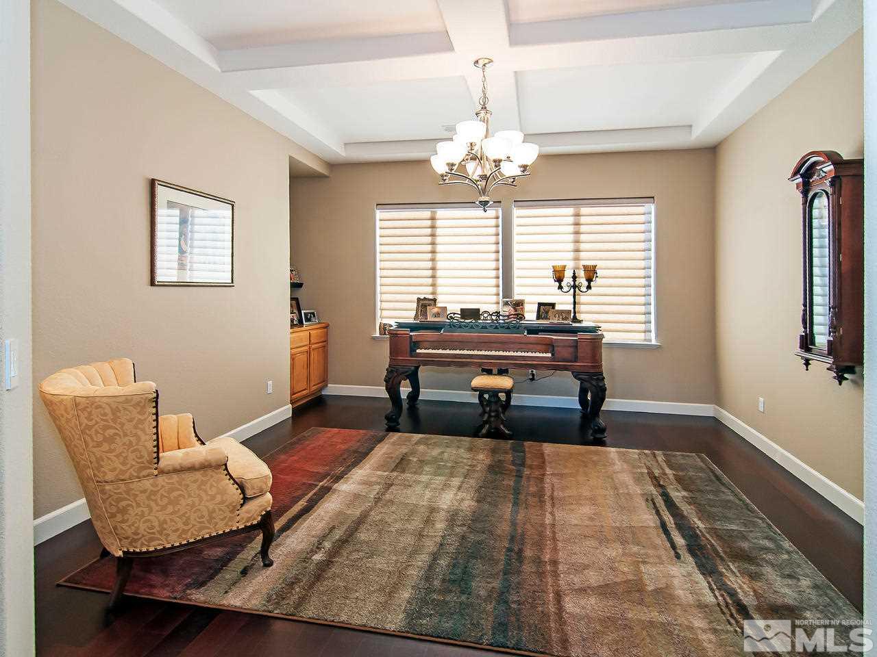 2690 Strathmore Court Reno, NV 89521 - Photo 10 of 25 a living room with furniture and a chandelier
