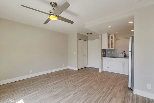 a kitchen with stainless steel appliances granite countertop a sink stove and microwave