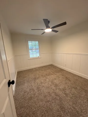 a view of a big room with windows