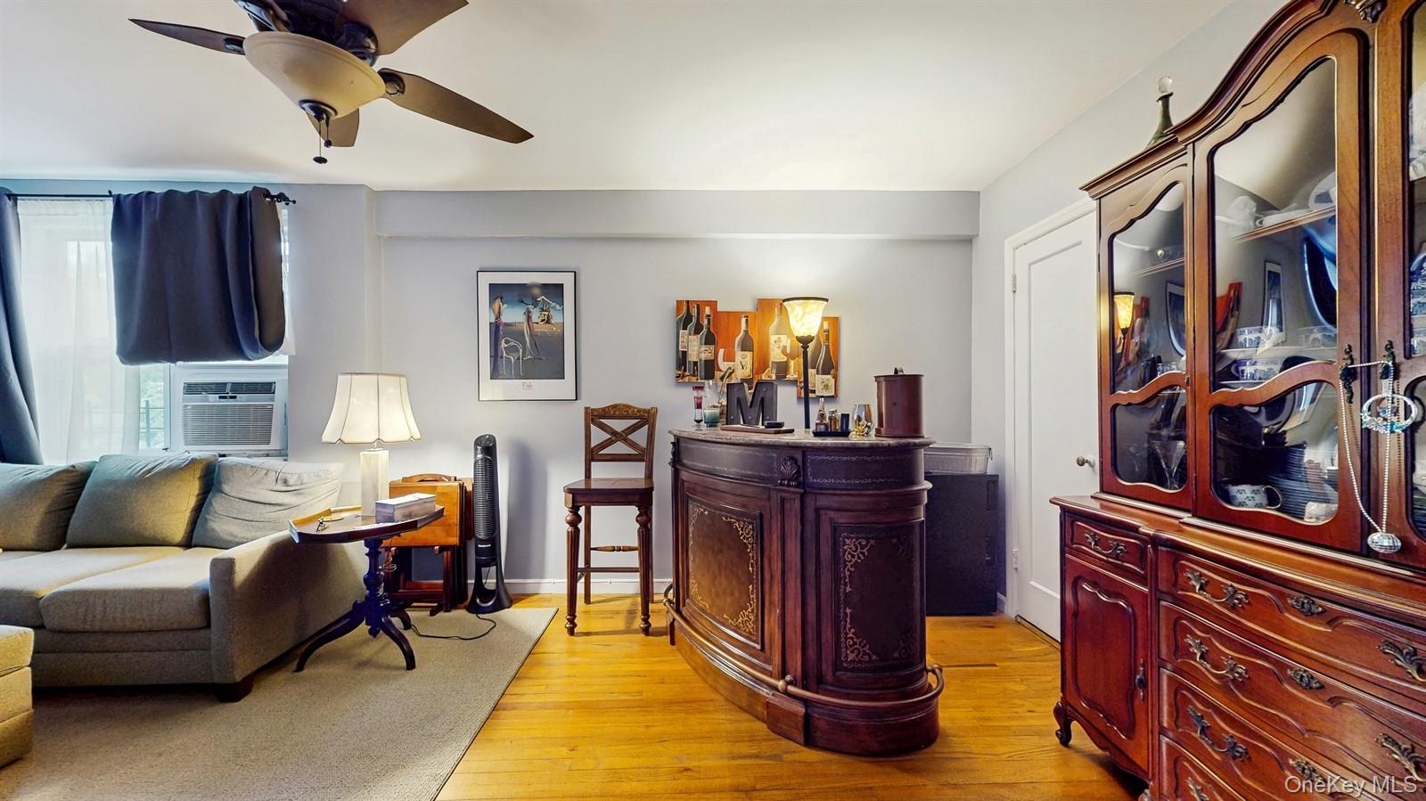 755 Bronx River Road, Unit 6C Bronxville, NY 10708 - Photo 4 of 22 a living room with furniture and a fireplace