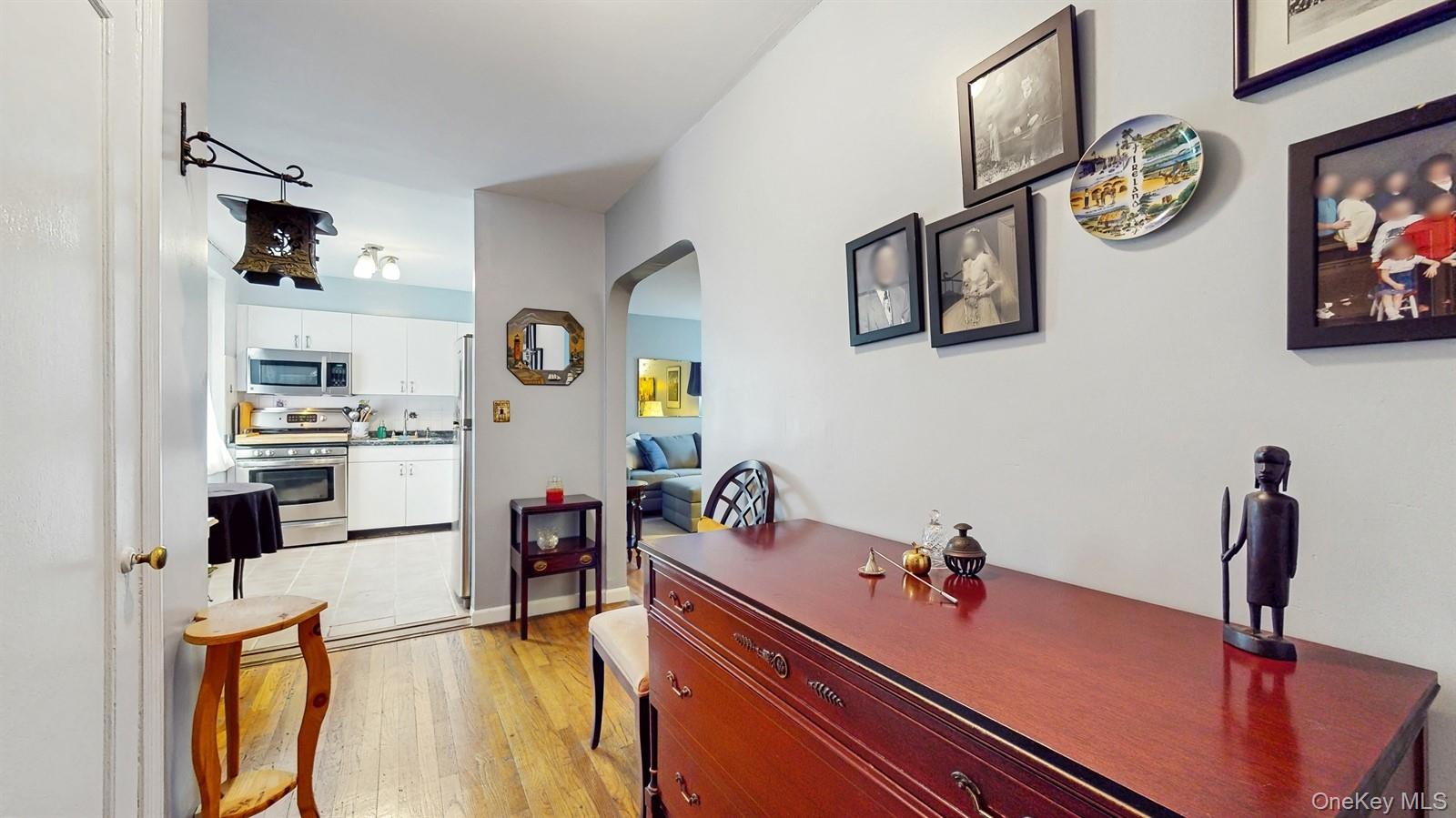 755 Bronx River Road, Unit 6C Bronxville, NY 10708 - Photo 8 of 22 a kitchen with stainless steel appliances granite countertop a sink and a refrigerator