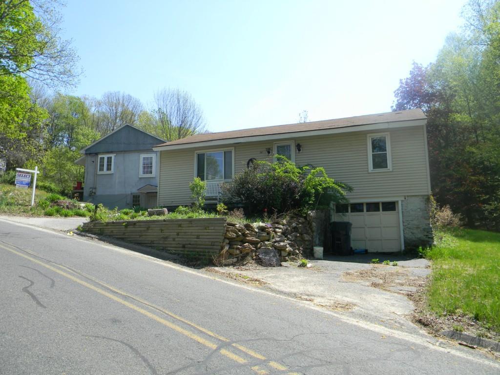 335 Scott Road Plymouth, CT 06786 - Photo 1 of 1 a front view of a house with a garden