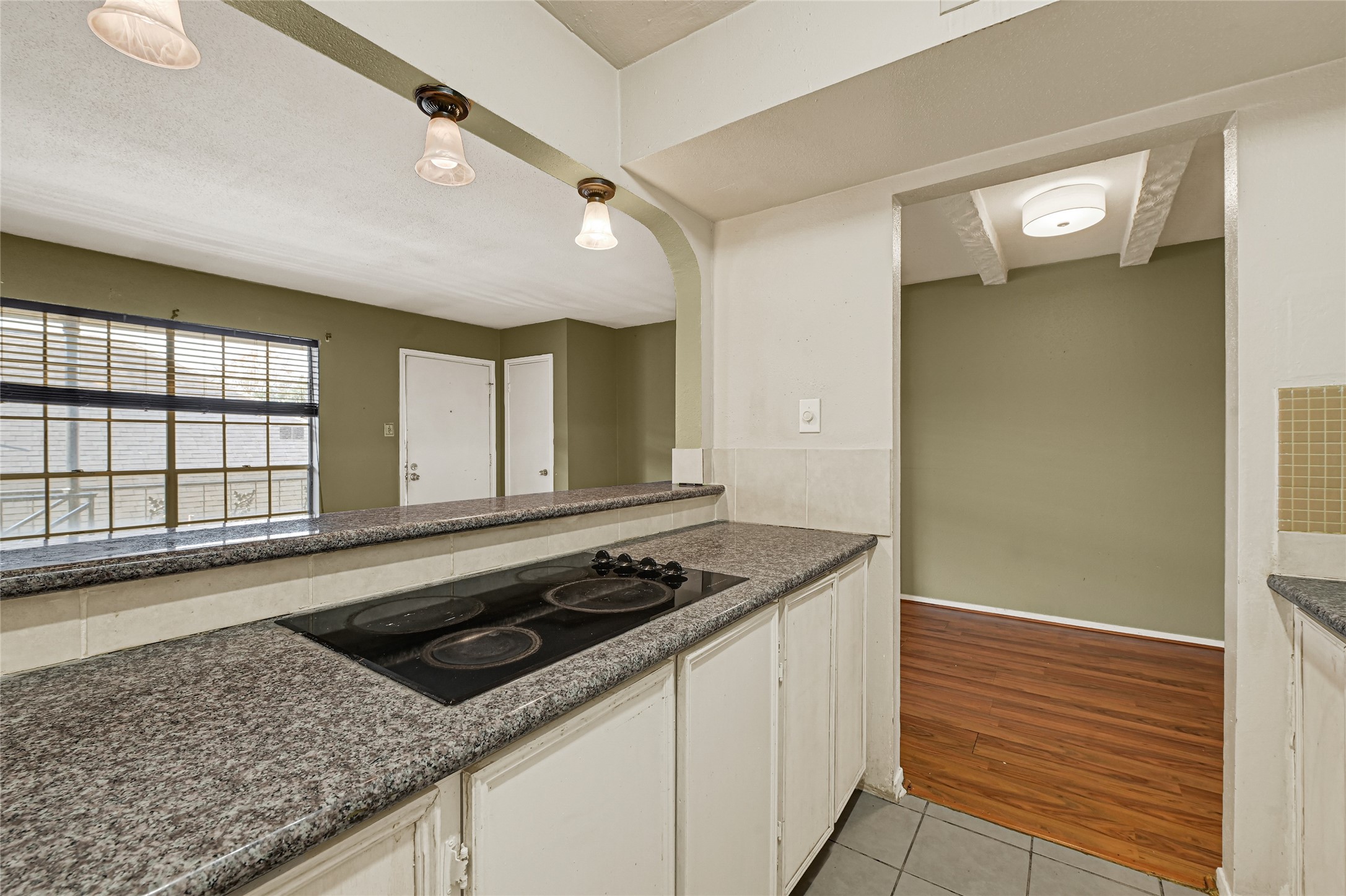 11550 Chimney Rock Road, Unit 232 Houston, TX 77035 - Photo 12 of 30 a bathroom with a granite countertop sink and a large mirror