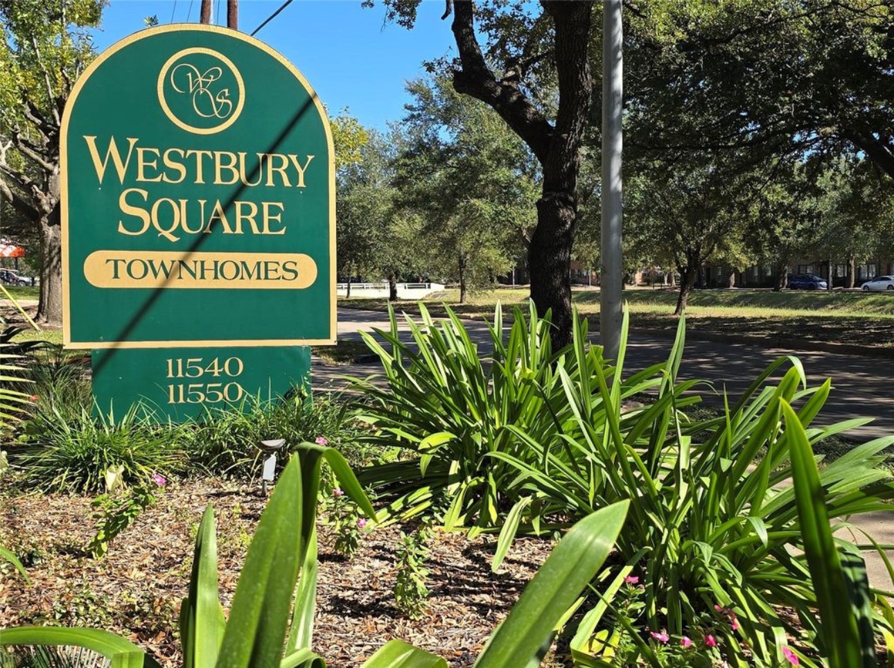 11550 Chimney Rock Road, Unit 232 Houston, TX 77035 - Photo 2 of 30 a sign that is sitting on a brick wall