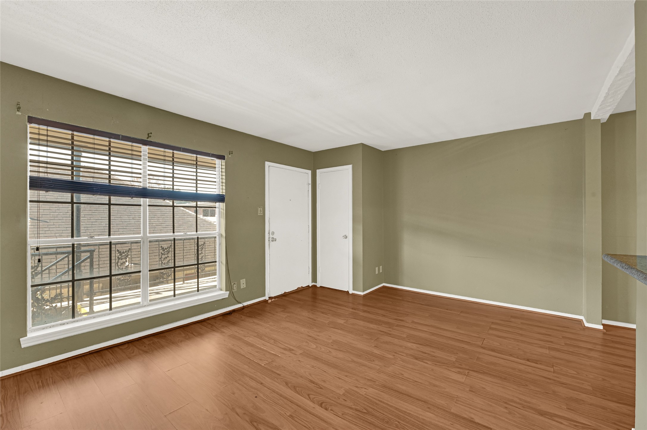 11550 Chimney Rock Road, Unit 232 Houston, TX 77035 - Photo 7 of 30 a view of empty room with wooden floor and fan