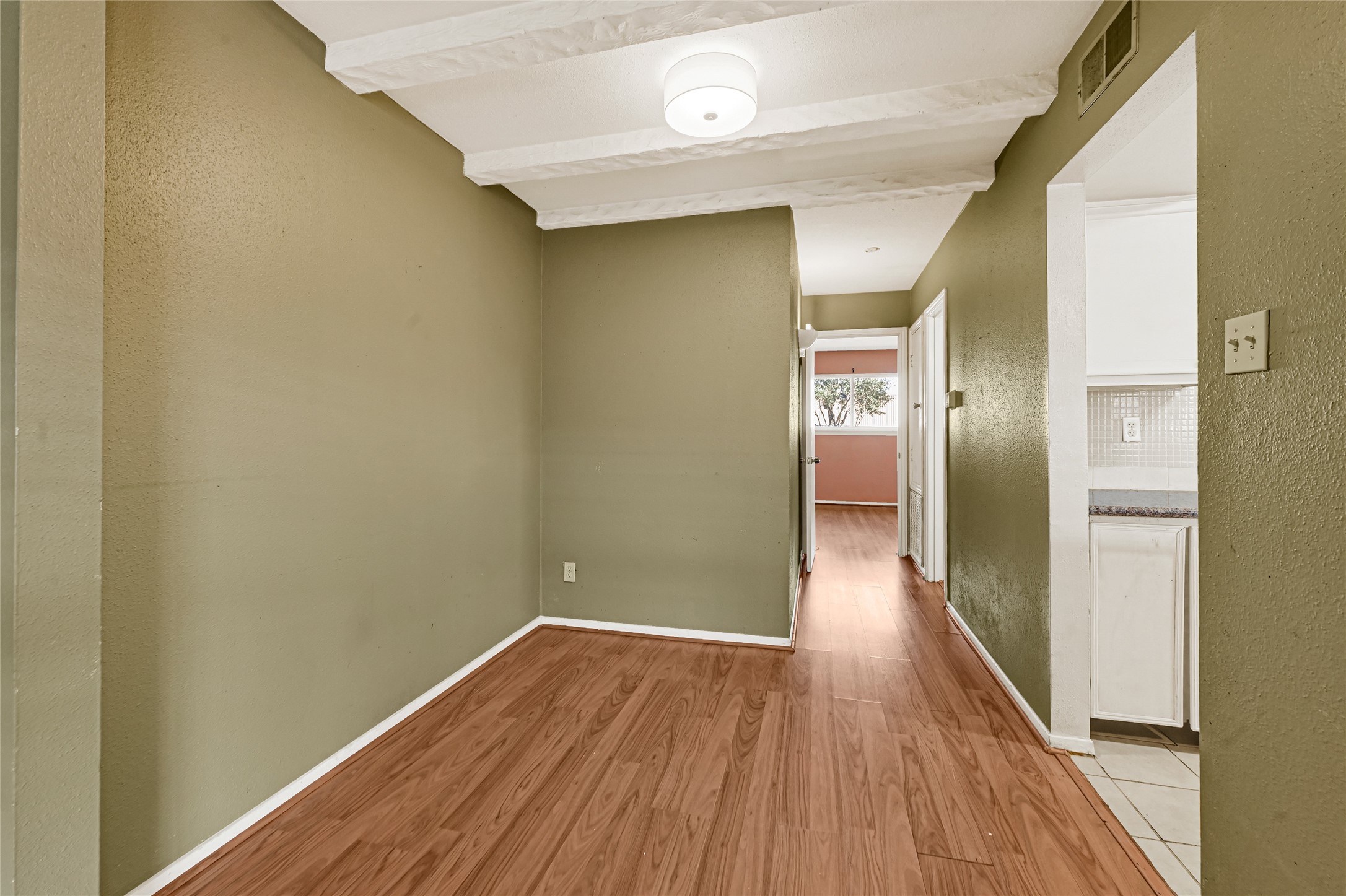 11550 Chimney Rock Road, Unit 232 Houston, TX 77035 - Photo 8 of 30 a view of a hallway with wooden floor