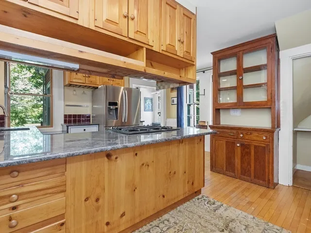 a view of a large kitchen with a window