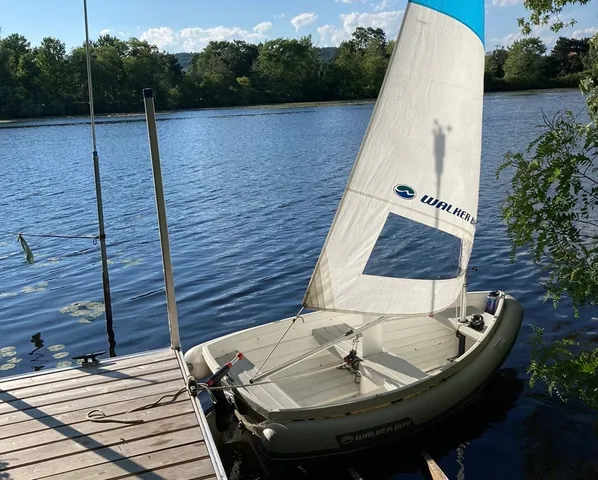 a view of a couches and dinning table and chairs in patio