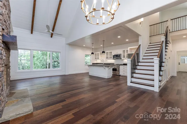 an open kitchen with a white cabinet and a stove top oven