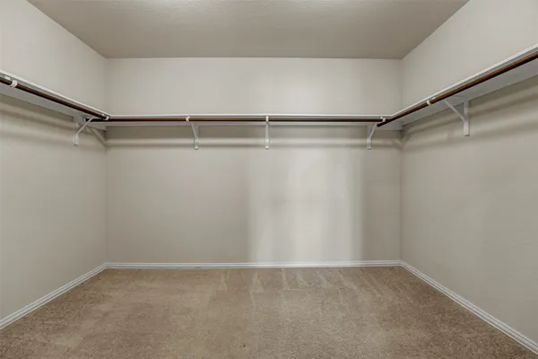 a view of an empty walk in closet